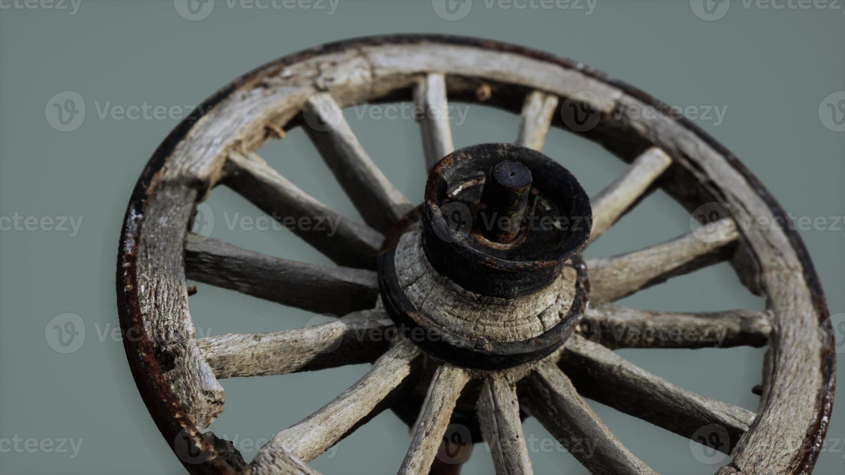 Handmade rustic vintage wooden wheel used in medieval wagons photo