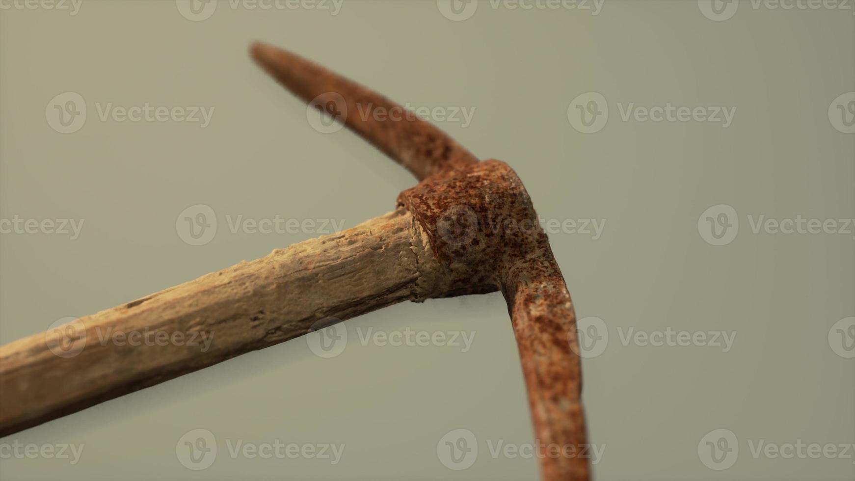 Close up of an old rusted pickaxe head photo