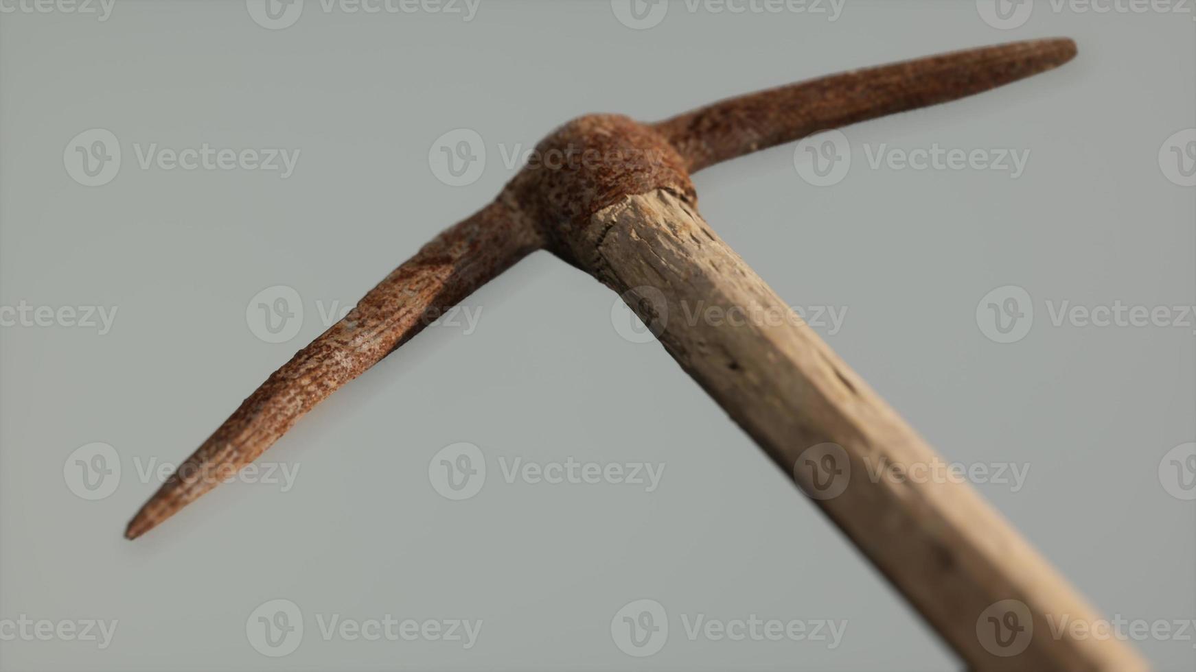 Close up of an old rusted pickaxe head photo