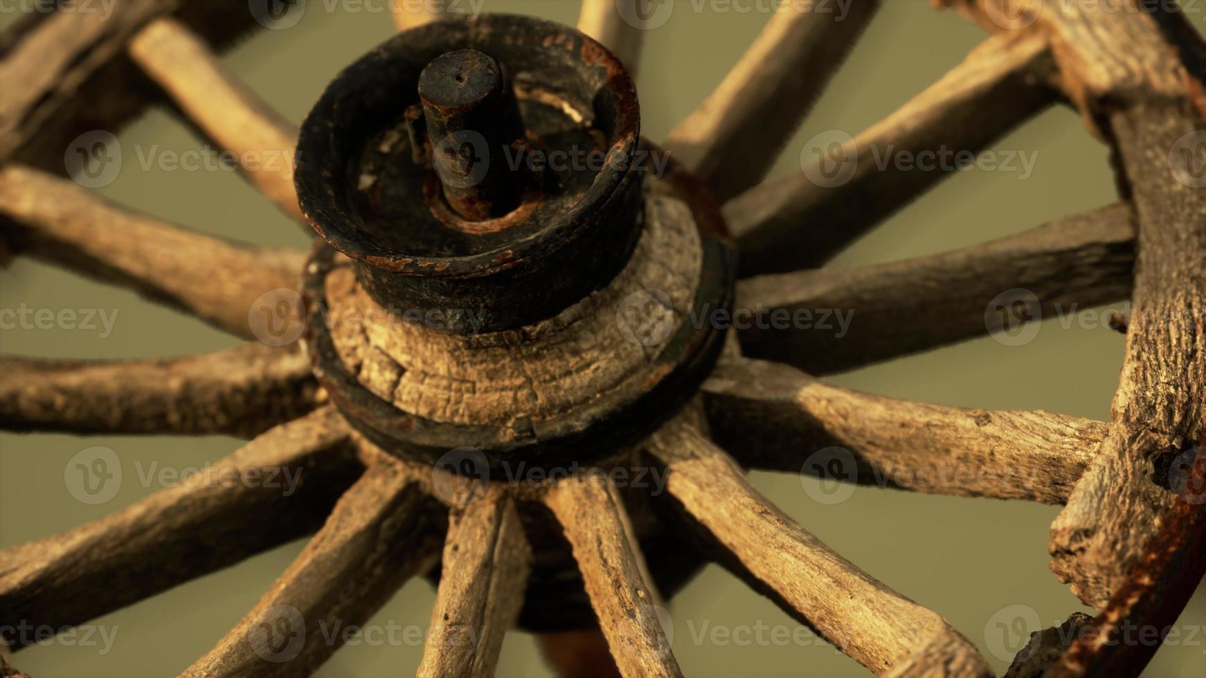 Handmade rustic vintage wooden wheel used in medieval wagons photo