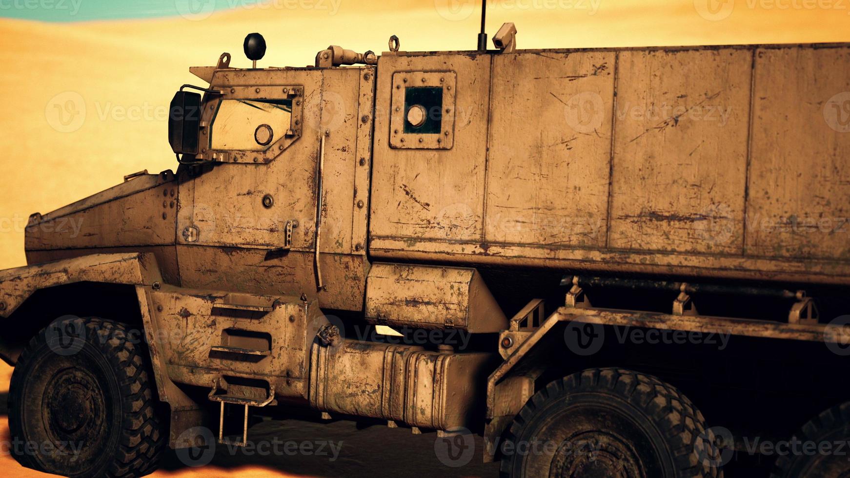 Armoured military truck in desert photo