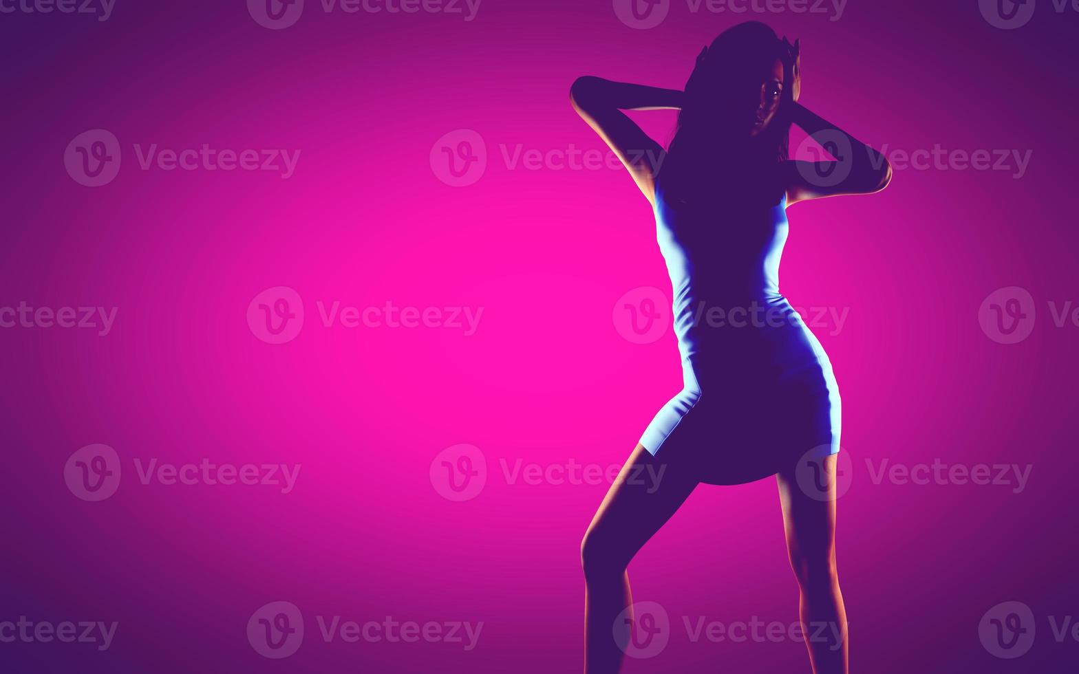 woman in dress at pink background photo