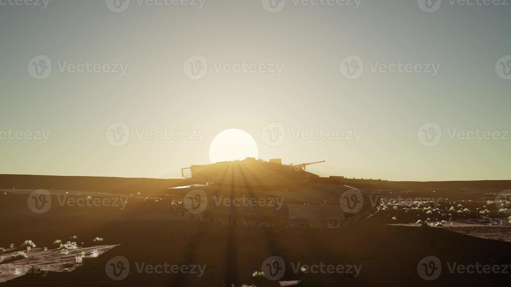 old rusty tank in the desert at sunset photo