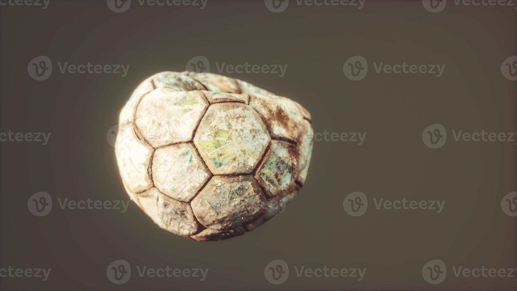 old deflated leather soccer ball photo