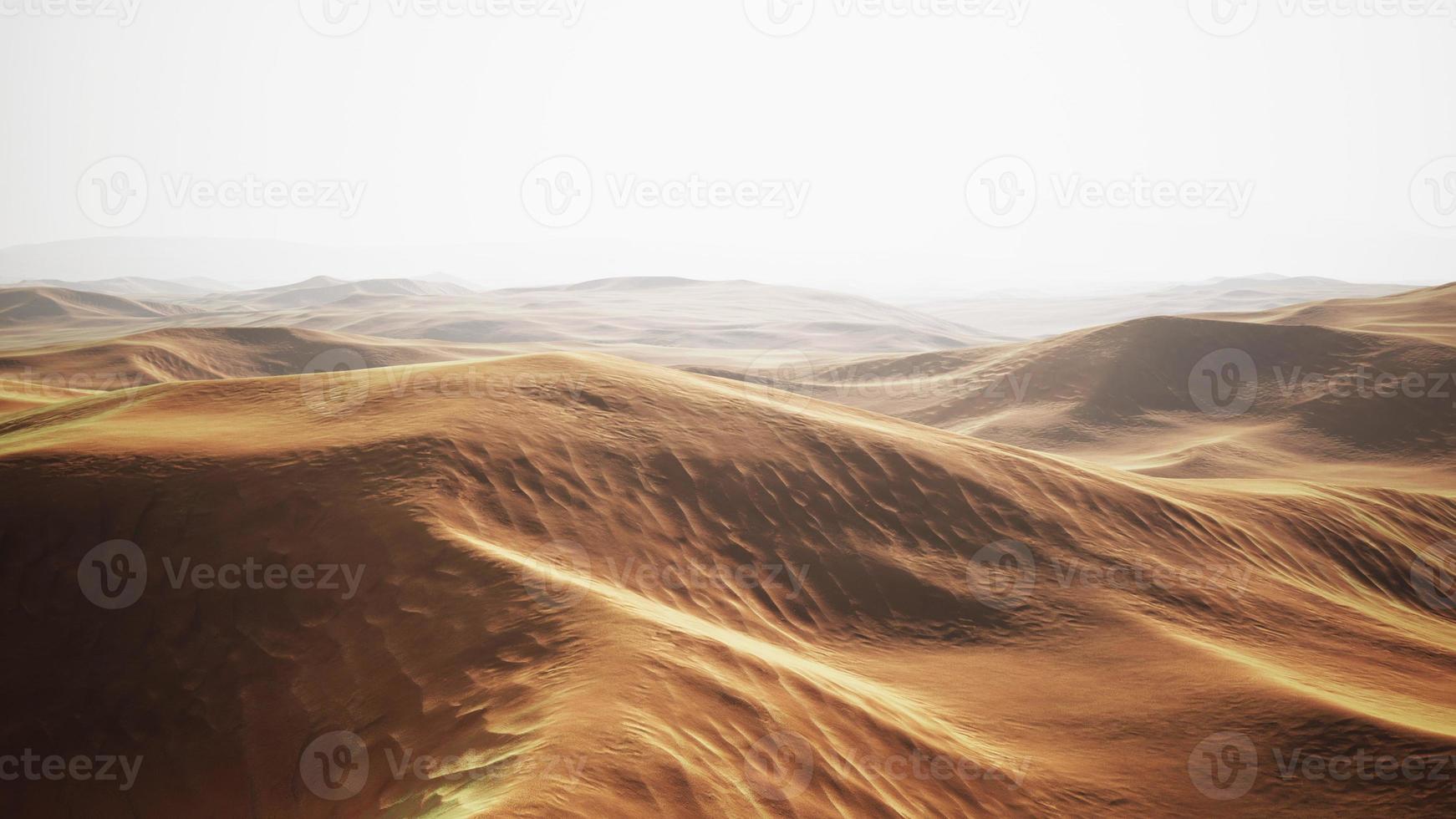dunas de arena al atardecer en el desierto del sahara en marruecos foto
