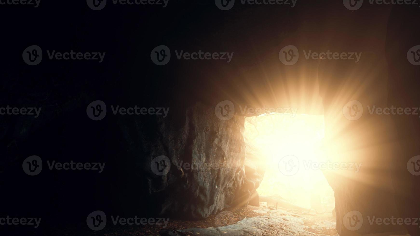 sunlight filters into a wet stone cave photo