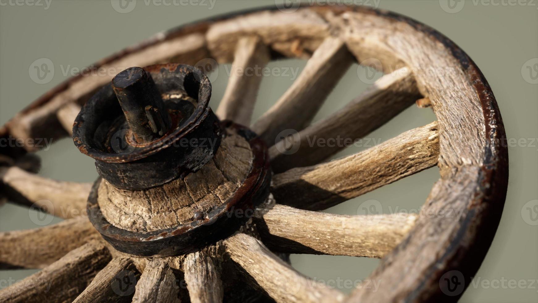 Handmade rustic vintage wooden wheel used in medieval wagons photo