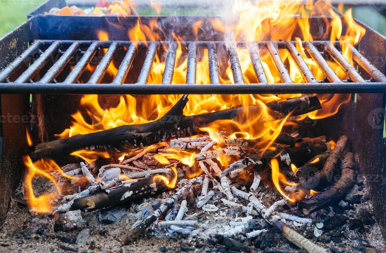 Charcoal Burning in BBQ or in the Frame Background . photo