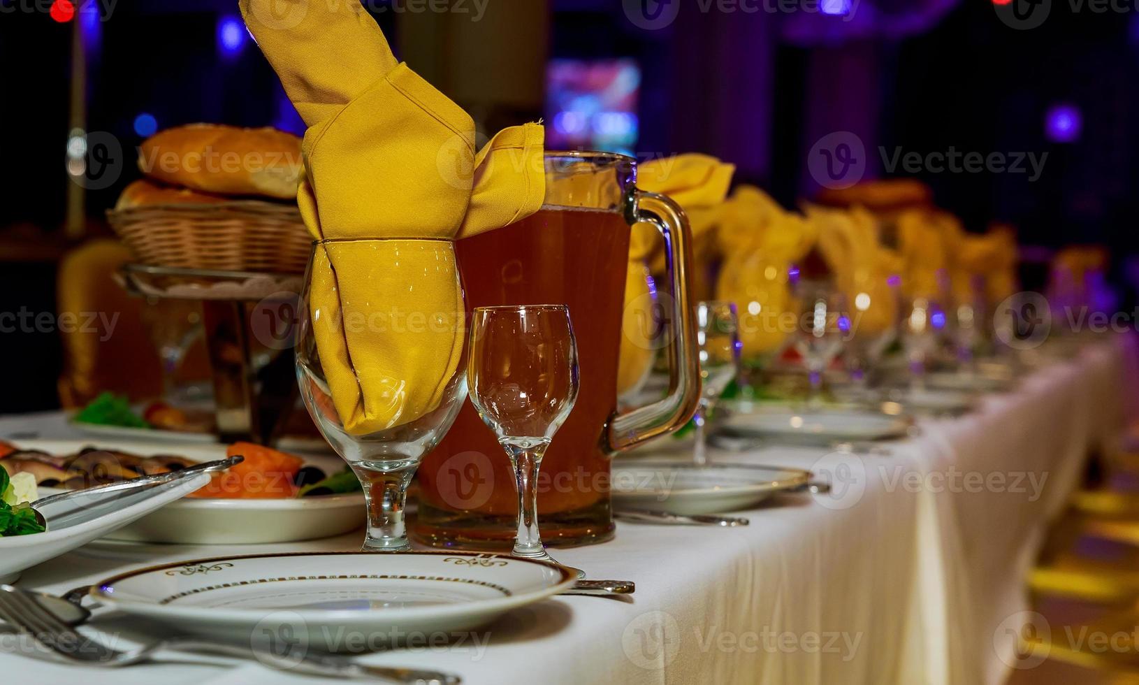 Beautifully decorated catering banquet table with different food snacks and appetizers photo