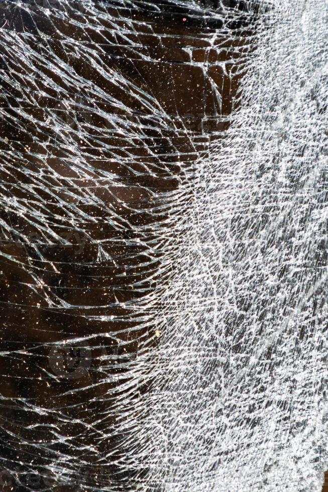 Cracked and abstract glass texture. Transparent material backdrop. Glass effect pattern. Mirror and glass background. photo