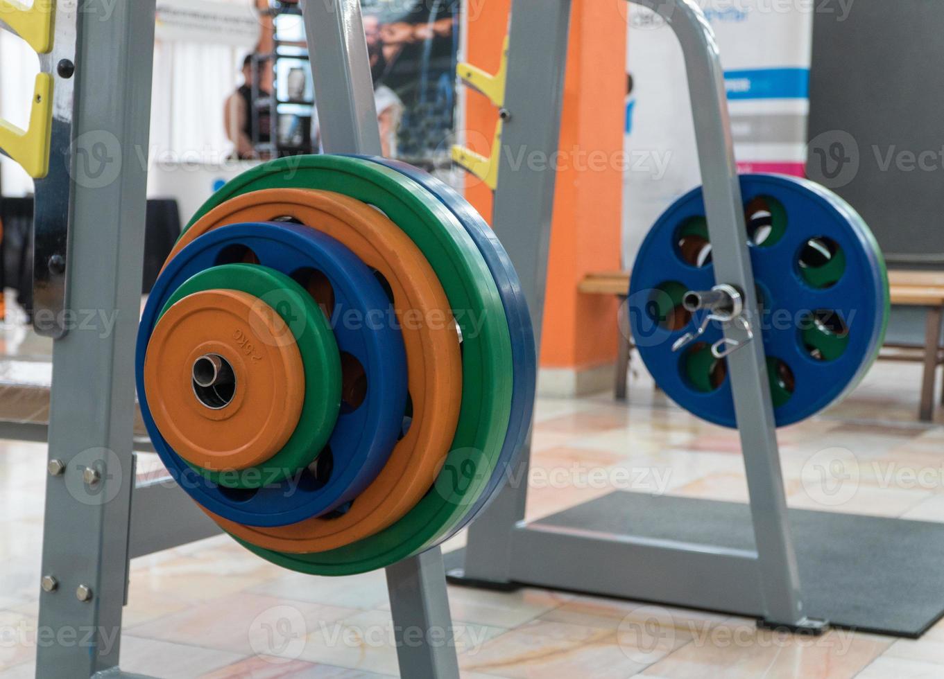 sports equipment and barbells in the gym, closeup photo