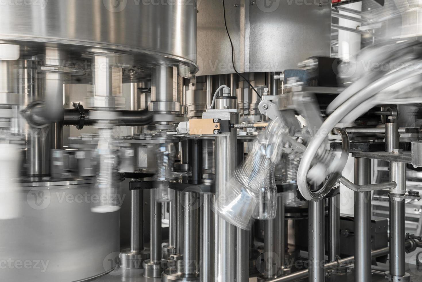 filling milk in to plastic bottles at the factory. equipment at the dairy plant photo