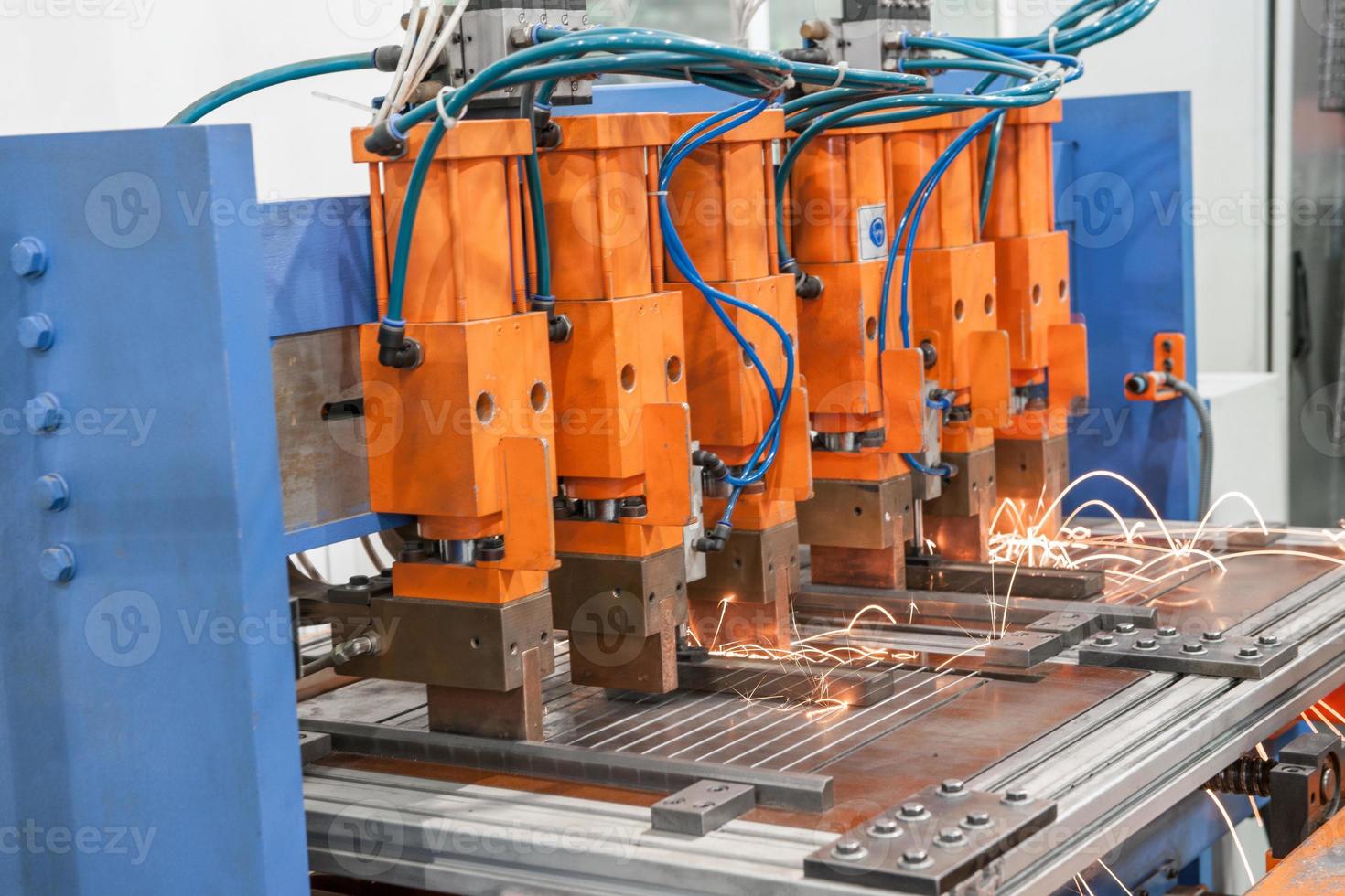 Industrial welding machines in the workshop, in the process of work and movement photo
