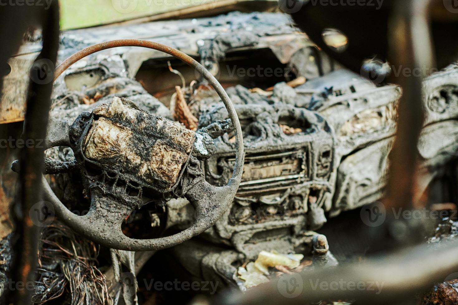 Burned car interior close up, vehicle fire damaged motor vehicle, car fire photo