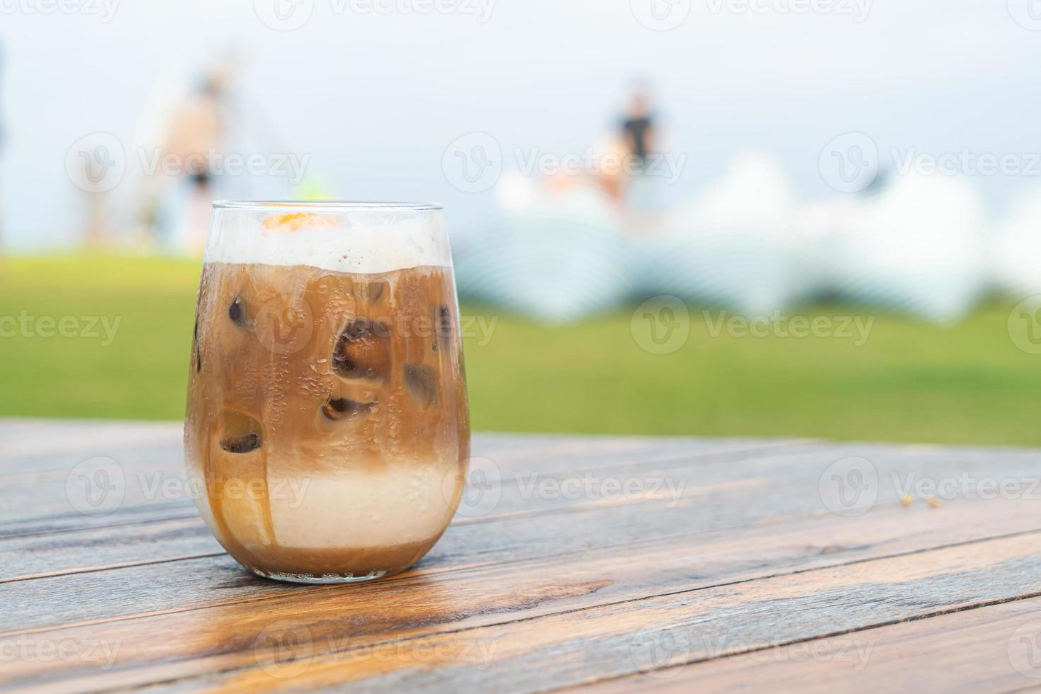 iced latte coffee glass on table photo
