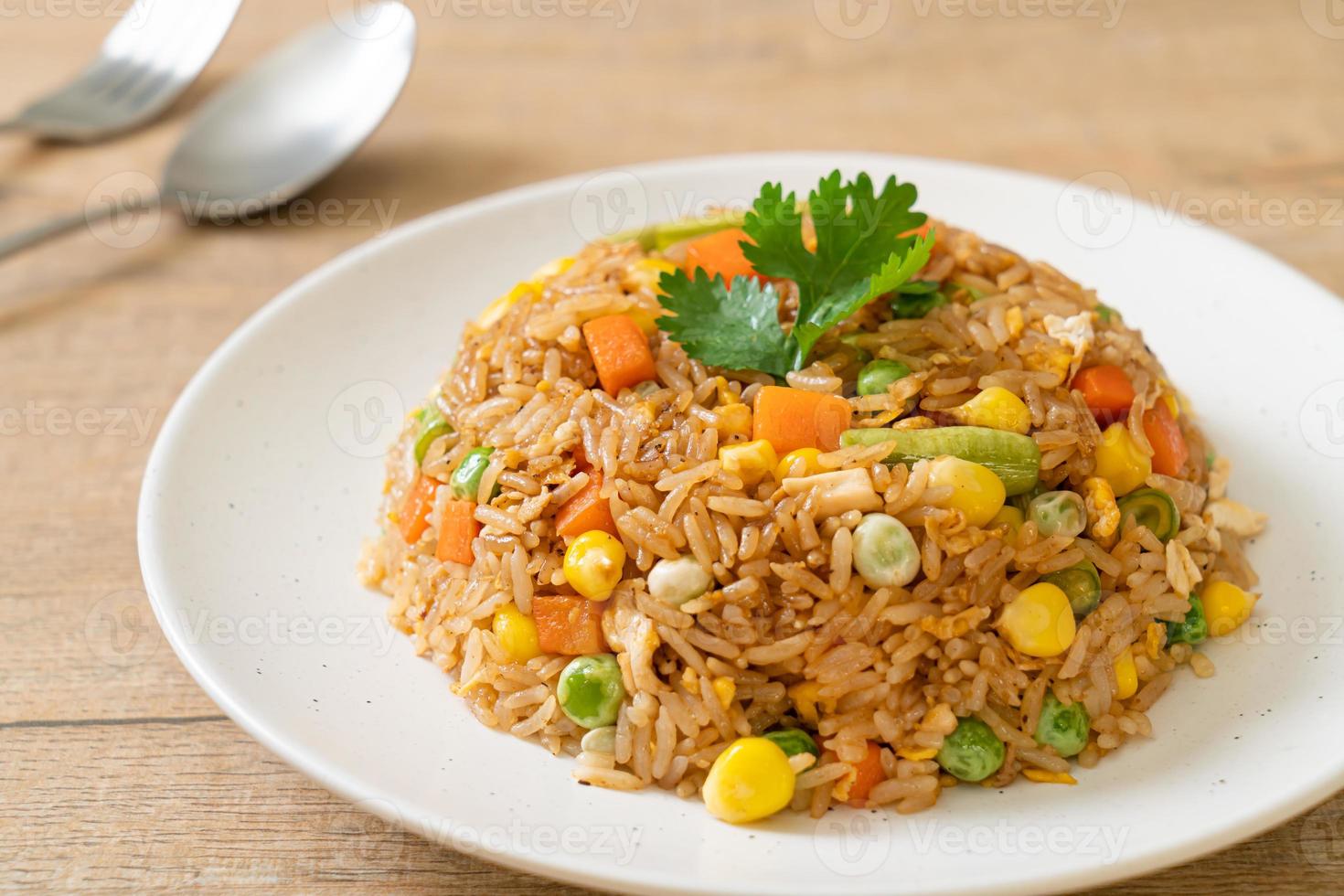 fried rice with green peas, carrot and corn photo