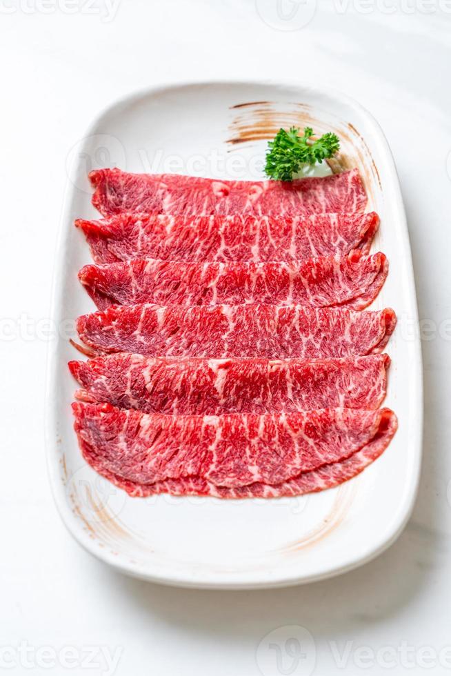 fresh beef raw sliced with marbled texture photo