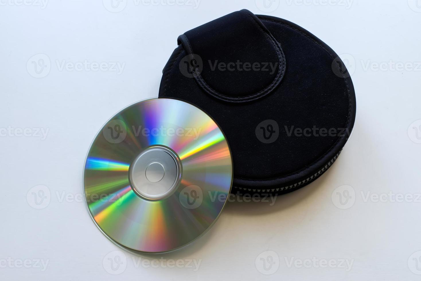 Compact disc and a black case on white background. Technology from the 90s. photo