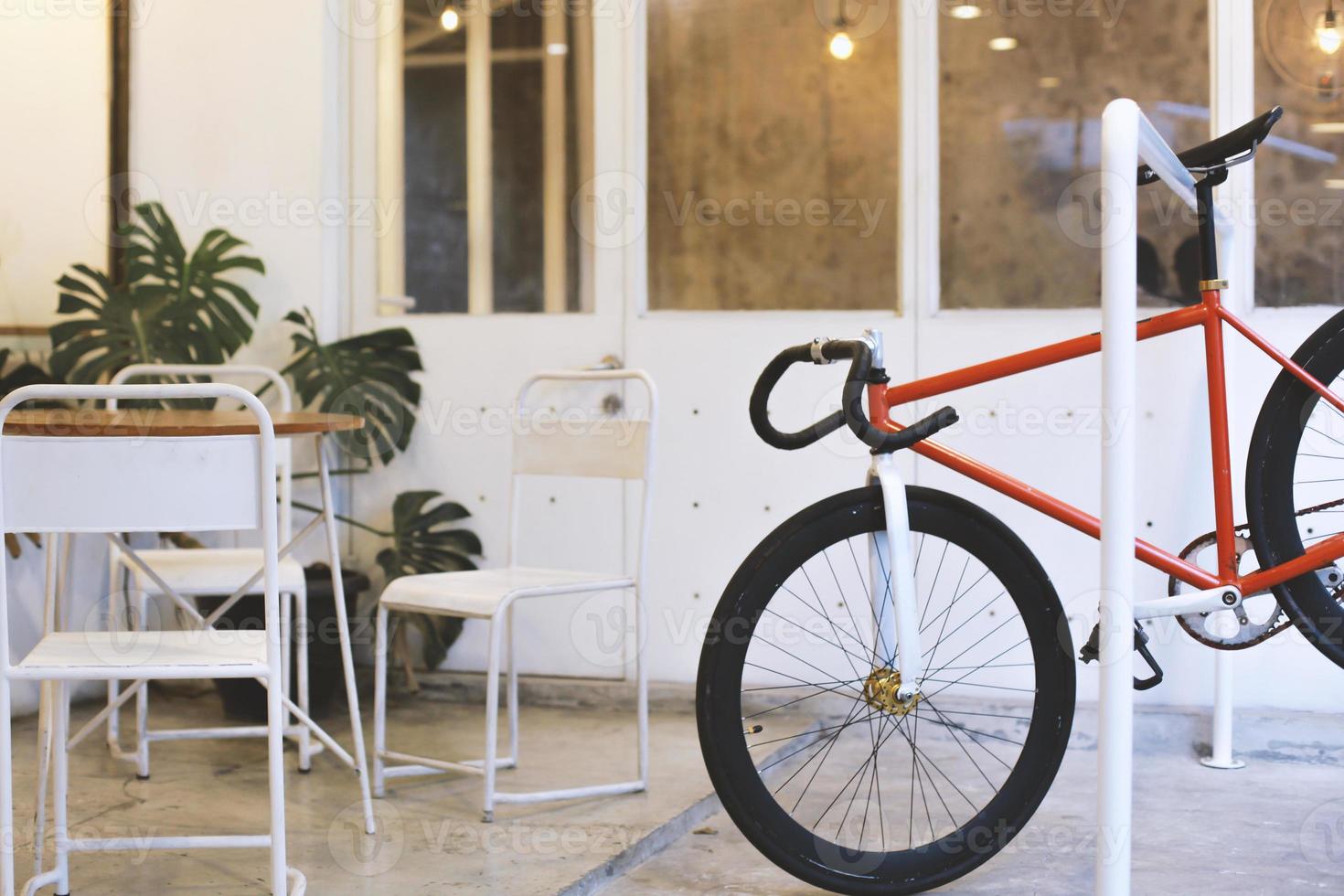 Exterior design. Outdoor terrace of coffee shop with bike parking space. Minimalistic style of the cafe exterior. photo