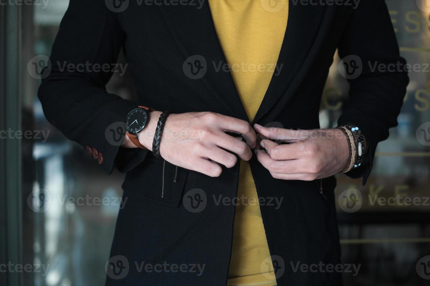 Elegant man in suit, fashion style, wearing suit and accessories photo