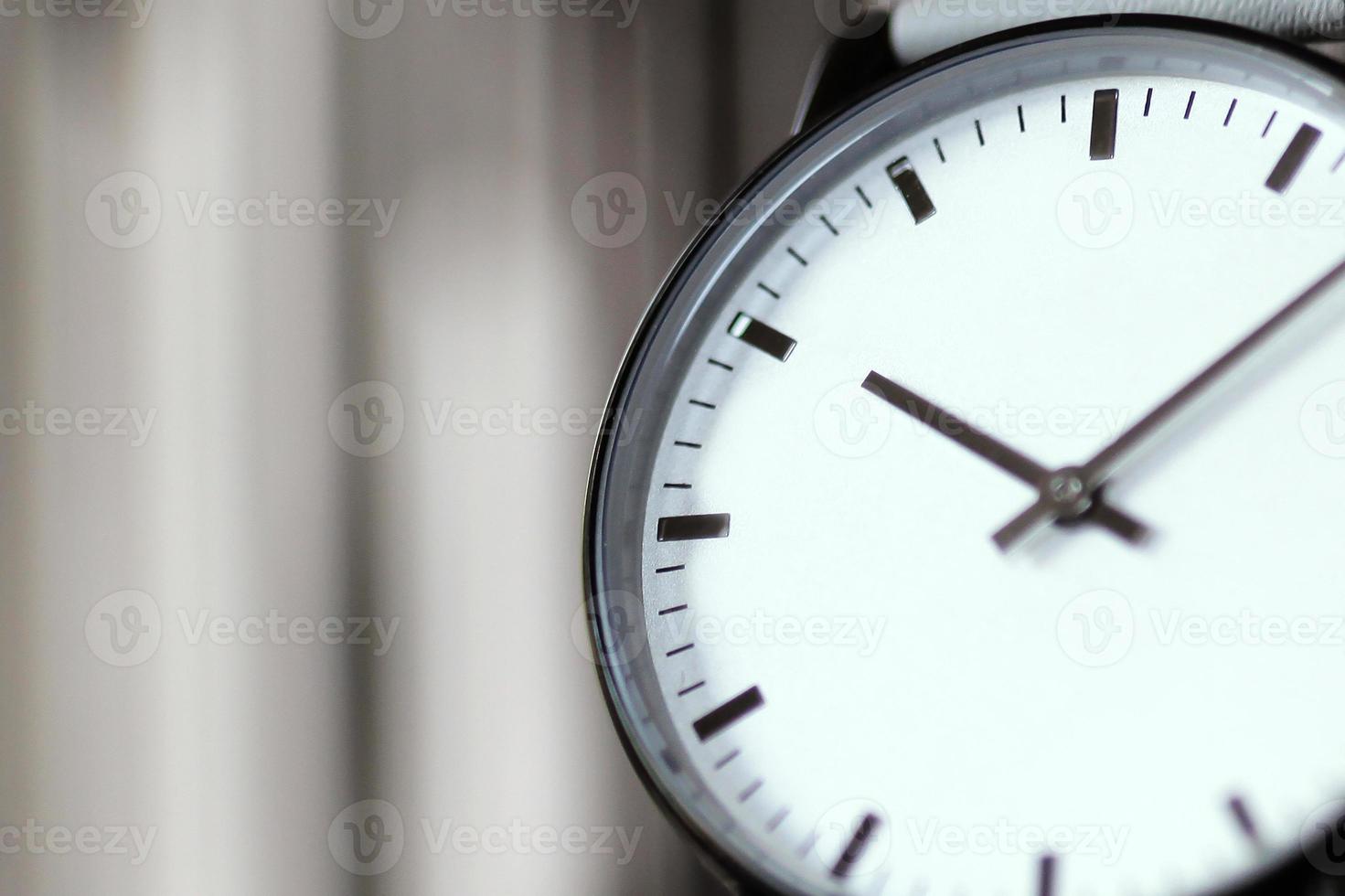 White wristwatch, close up detail. Blurred background photo