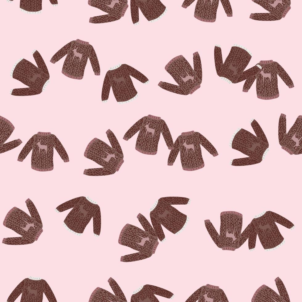 Random brown knitted sweaters ornament seamless pattern. Light pink background. vector