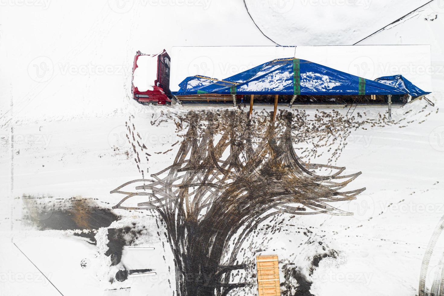 winter loading of a truck with cargo top view. photo