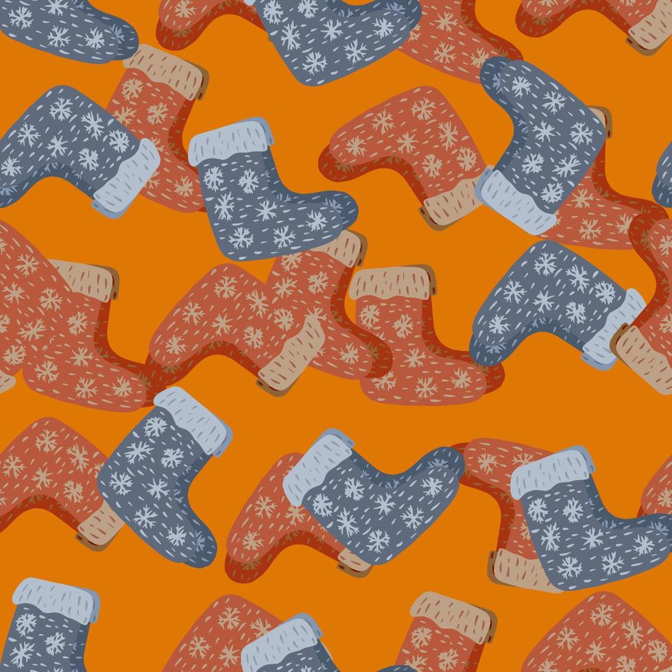 Random seamless winter pattern with painted winter red and blue shoes elements. Orange background. vector