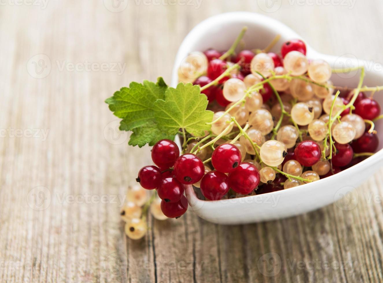 Red currents on table photo