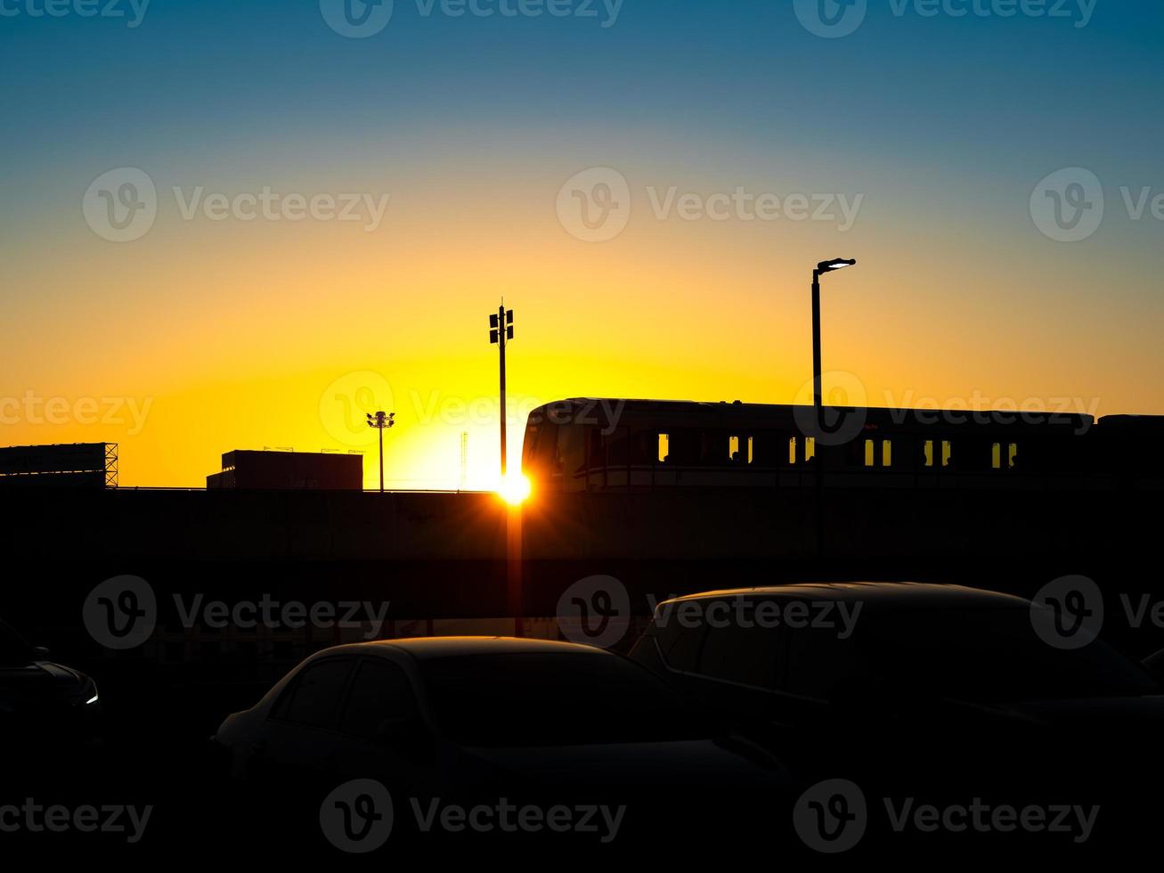 Silhouette of sky train inbound or outbound  in the beautiful sunset. photo