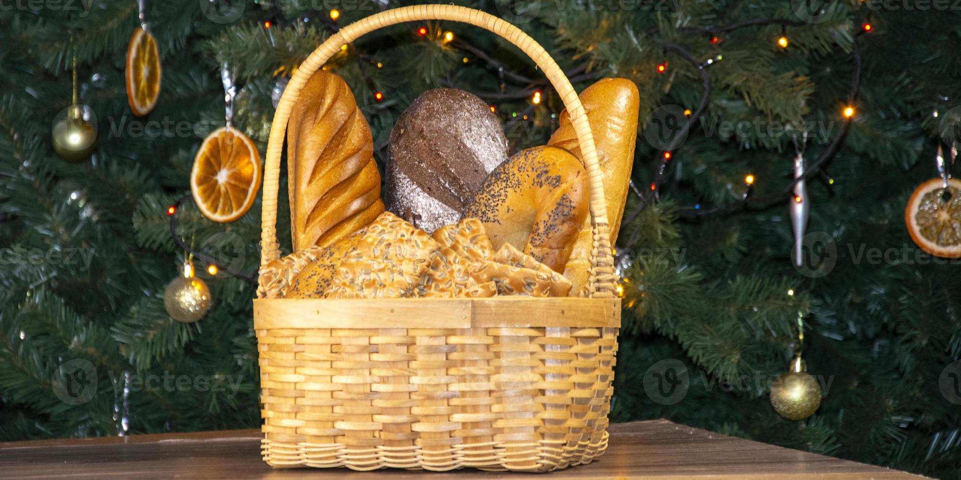 Basket with bread on the background of the Christmas tree. photo