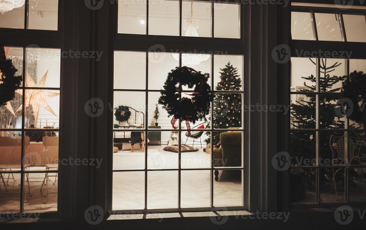 Christmas tree and decoration in the window photo