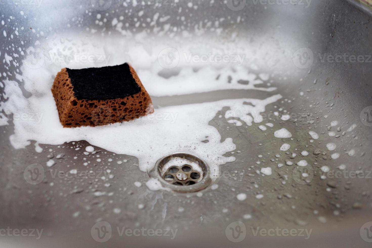 Cleaning kitchen sink photo