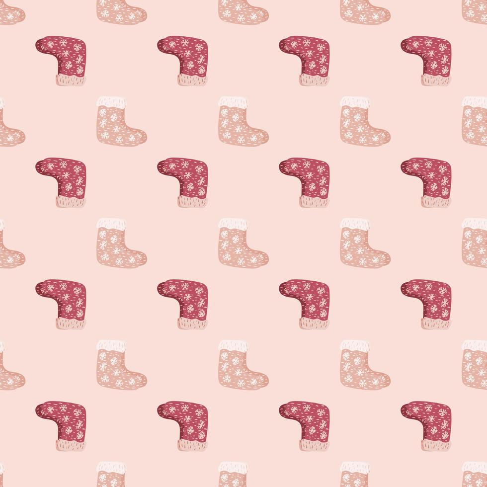 Decorative seamless pattern with christmas gift socks elements in pale pink tones. Winter backdrop. vector