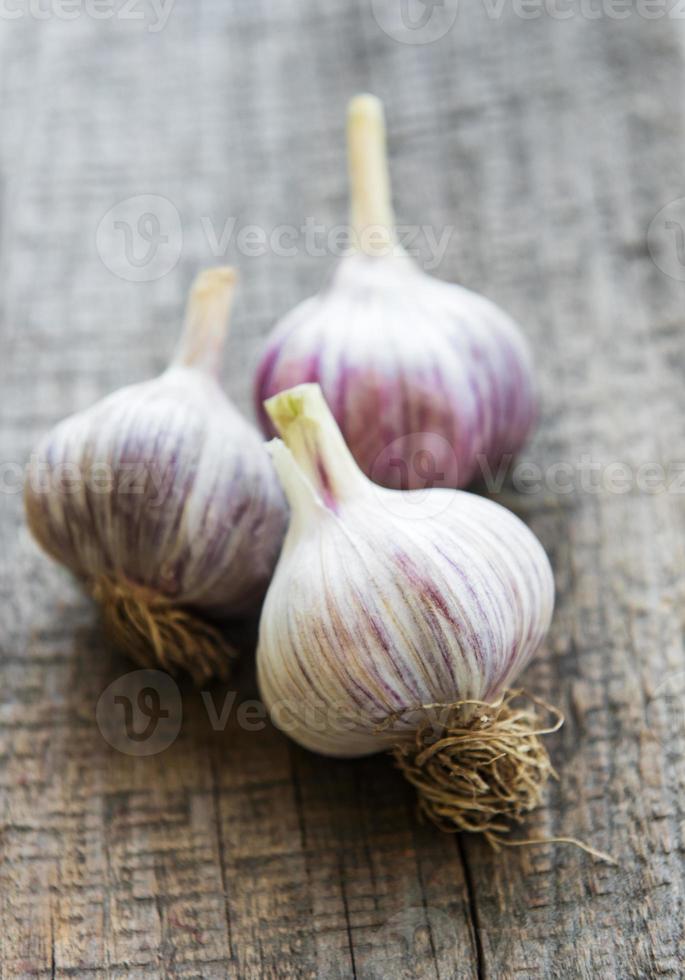 garlic on vintage wooden table photo