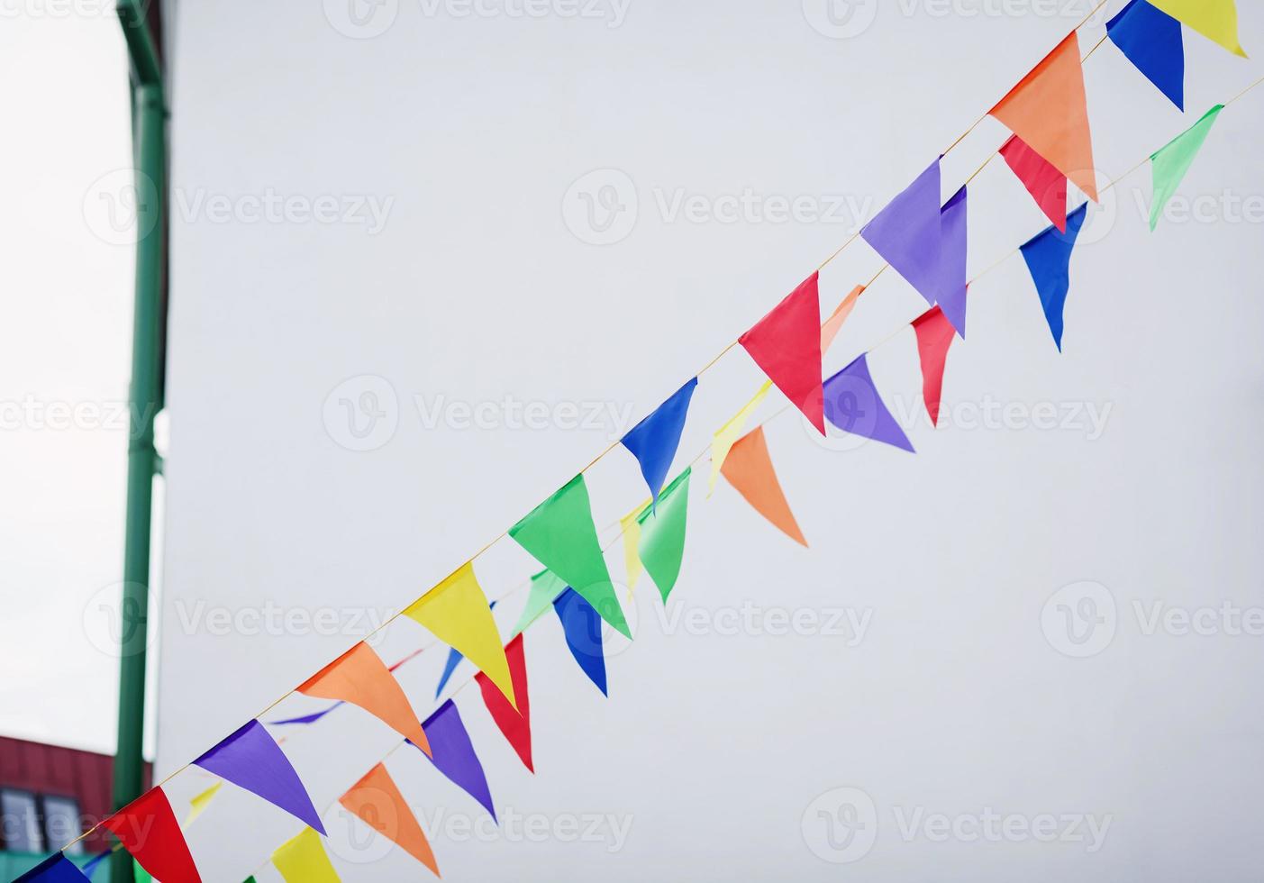 Multi colored triangular flags photo