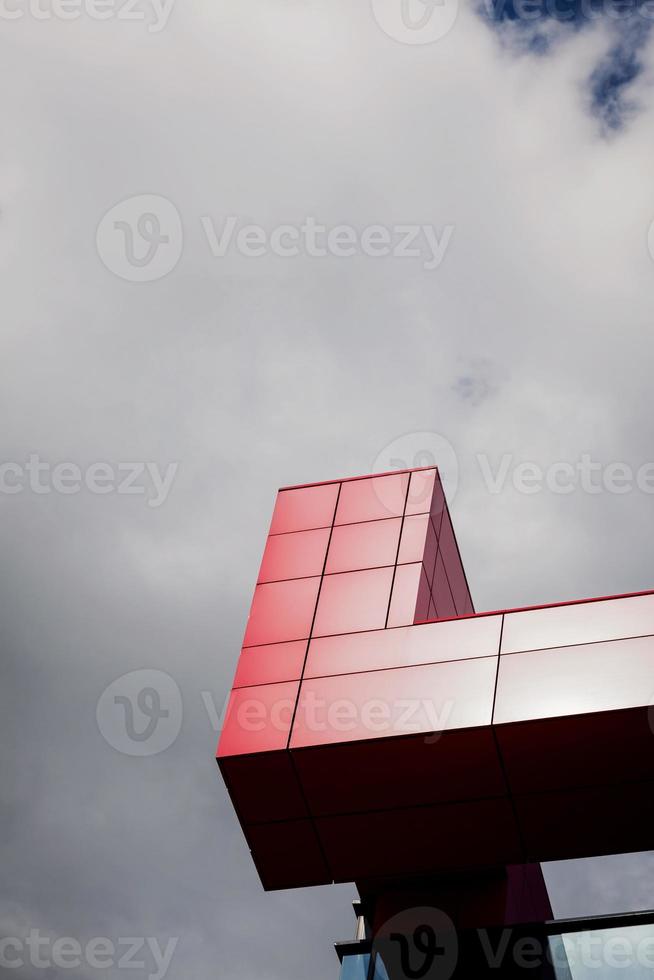 Fragment of red metal facade photo