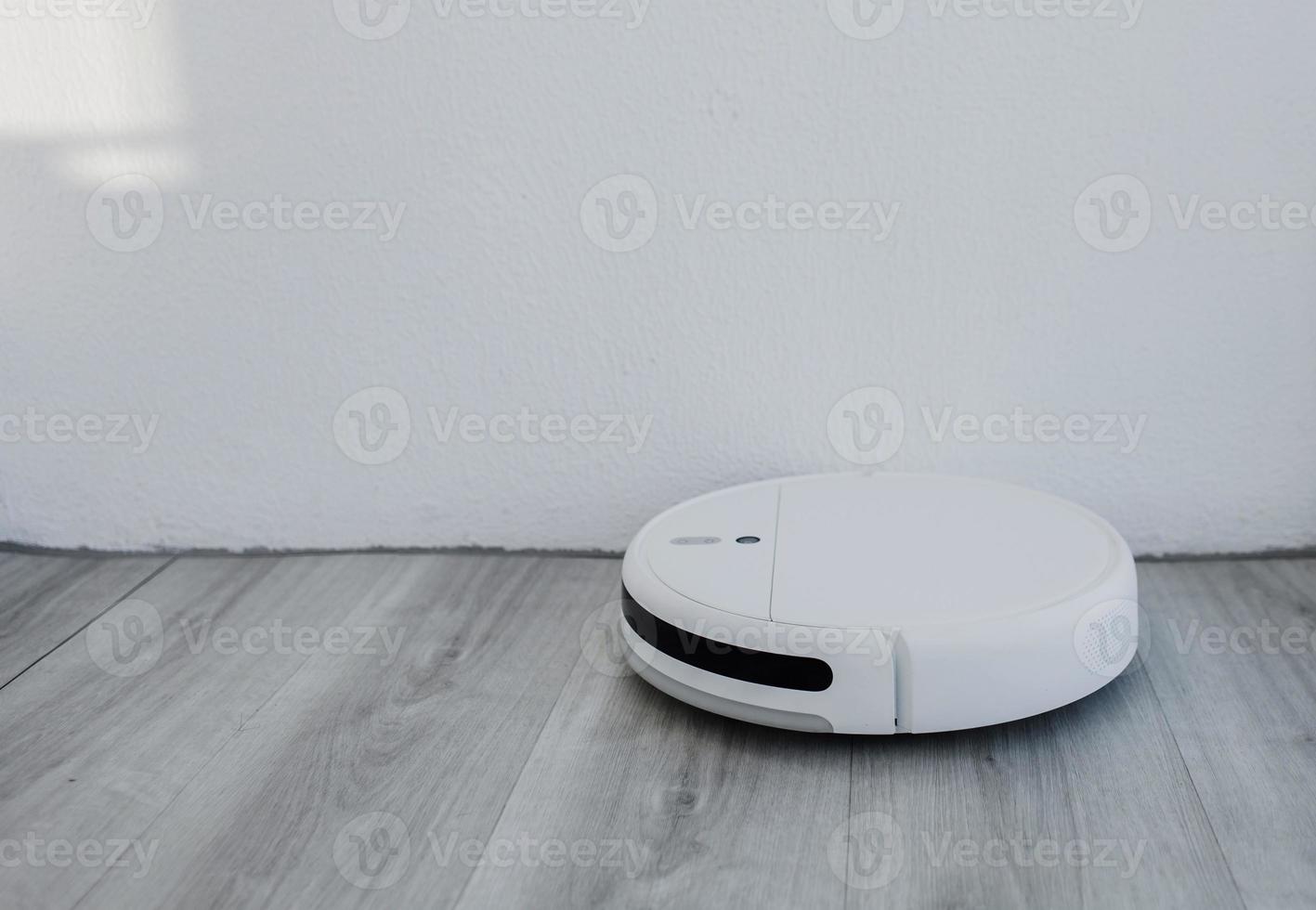 White robot vacuum cleaner photo