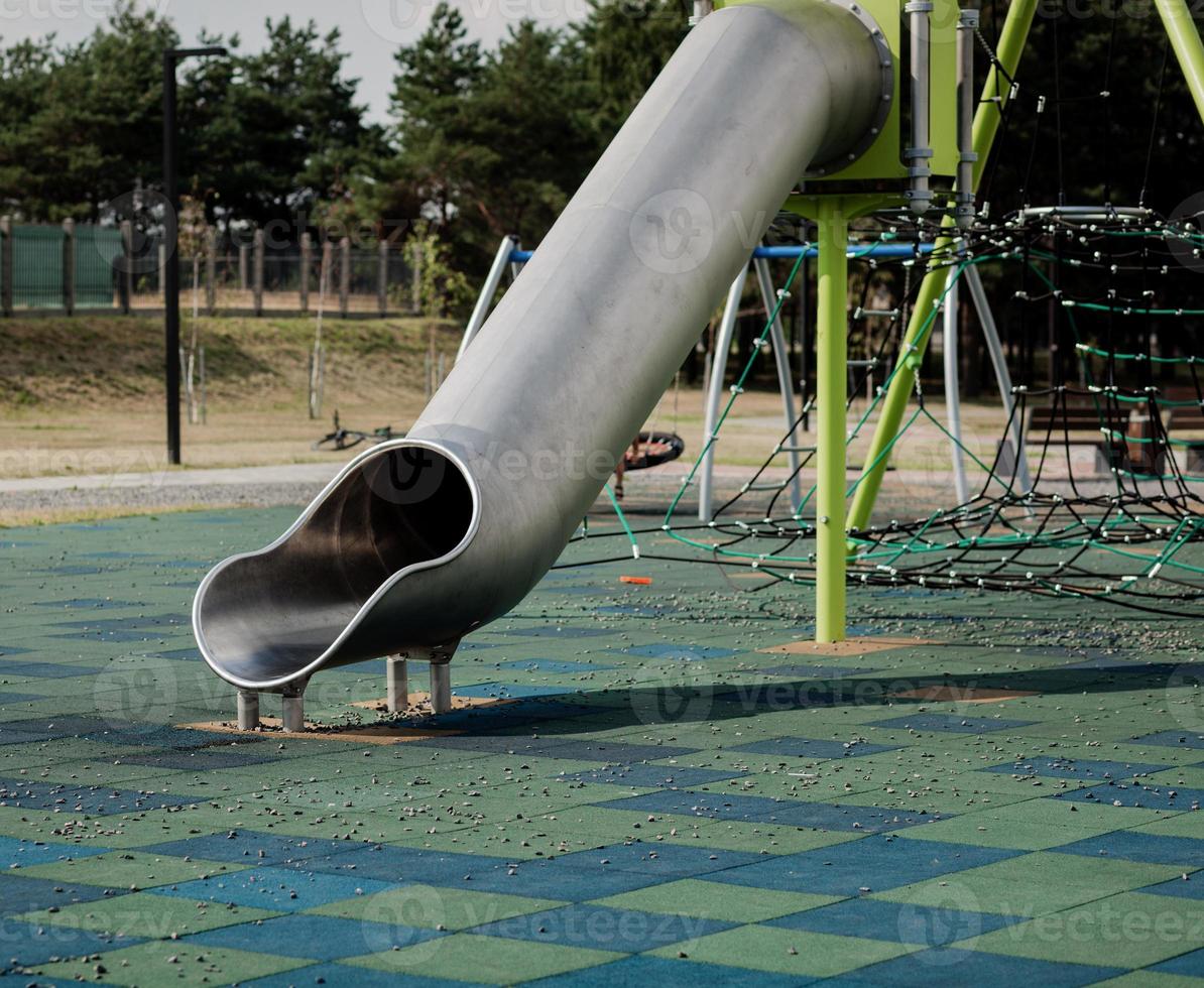 Children's playground with metal tube 5699652 Stock Photo at Vecteezy