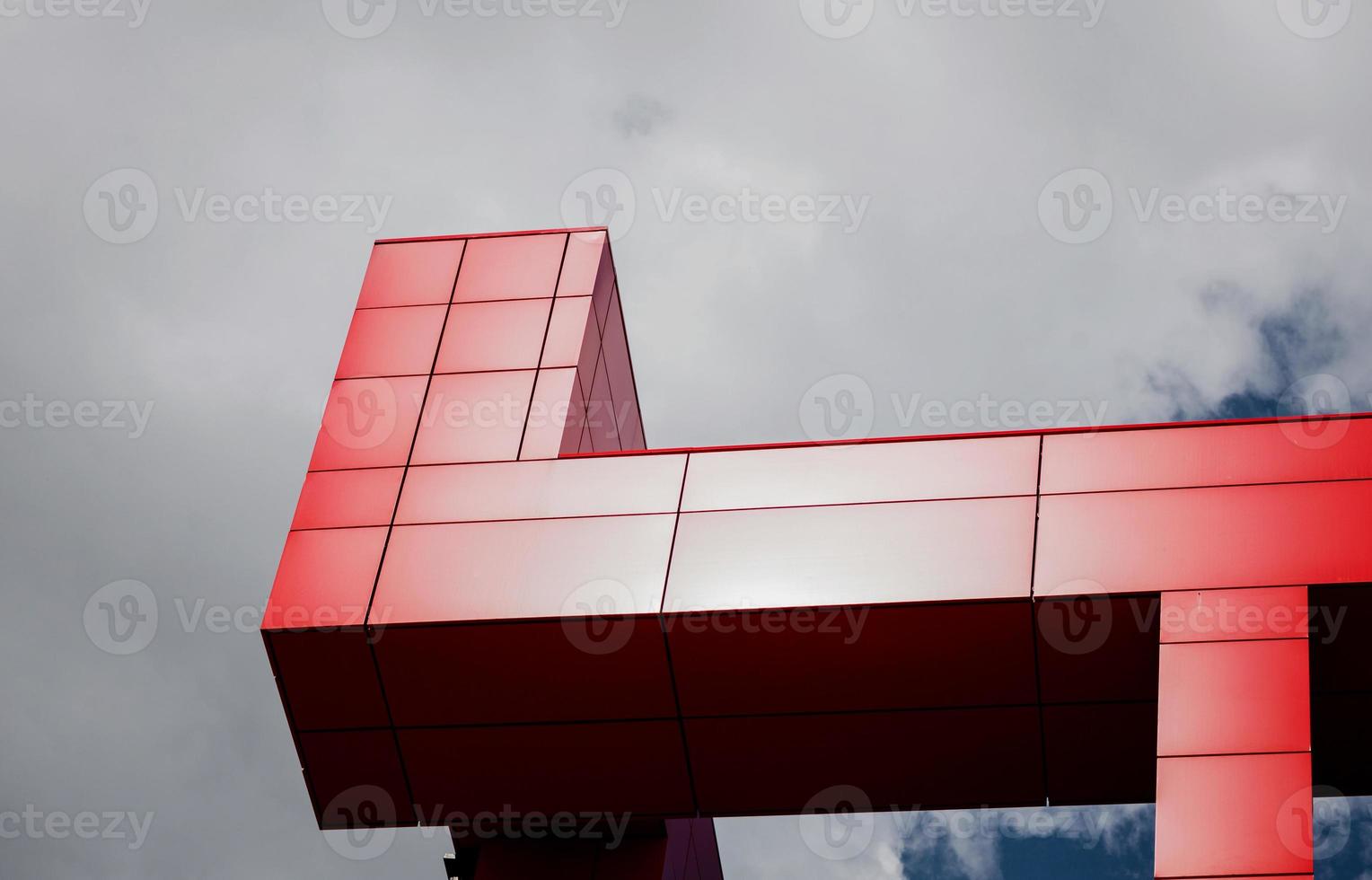 details of aluminum facade with colorful red panels photo