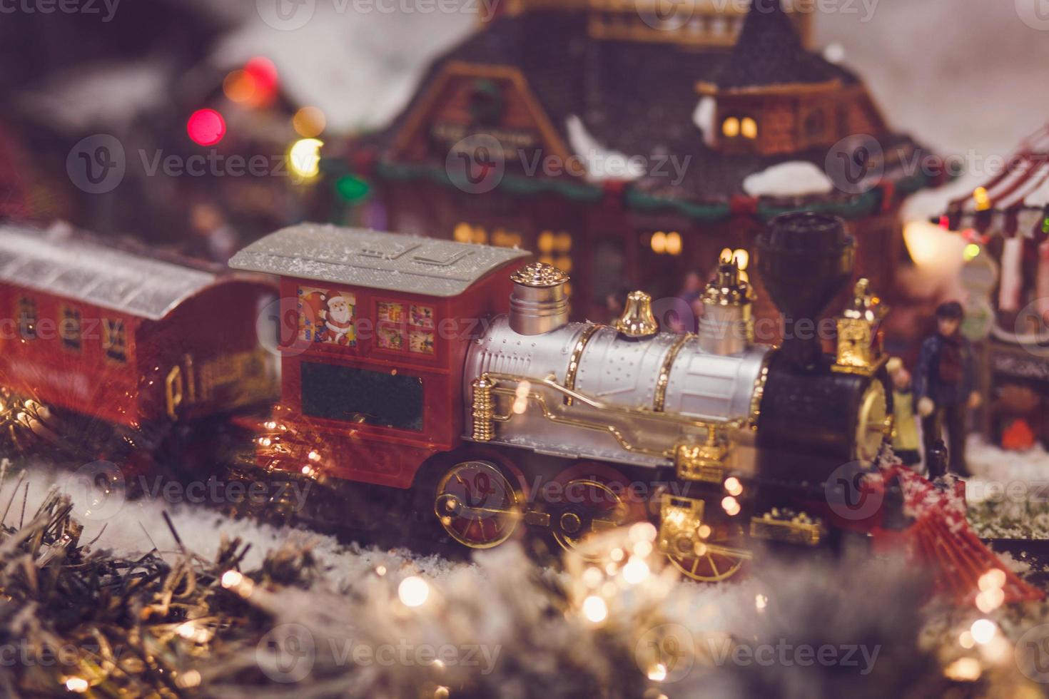 toy vintage steam locomotive decorated Christmas tree photo