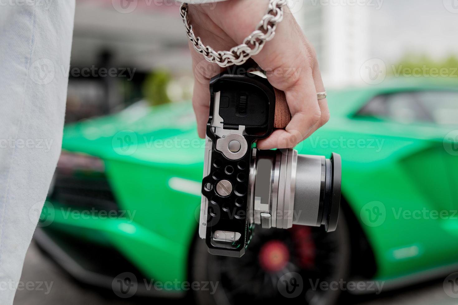 Tourist hold digital camera photo