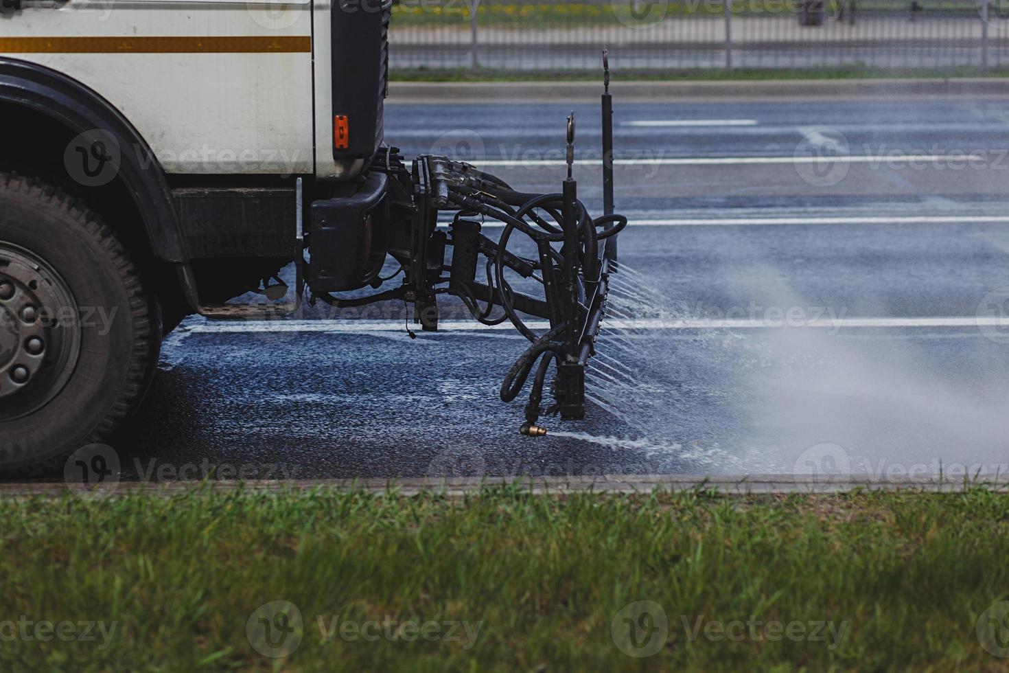 machines washes the city asphalt road photo