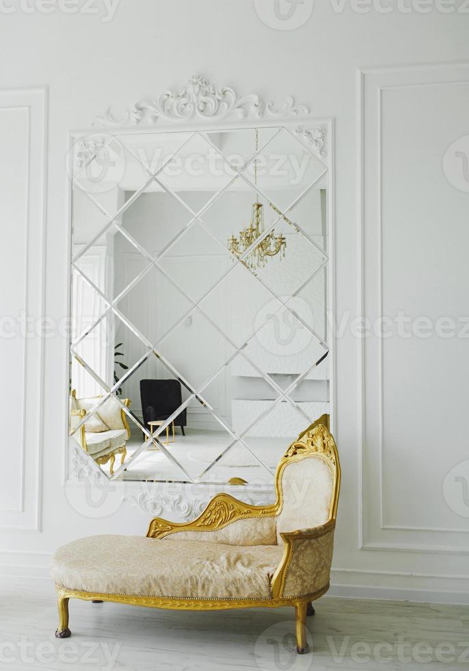 room with royal sofa and mirror photo