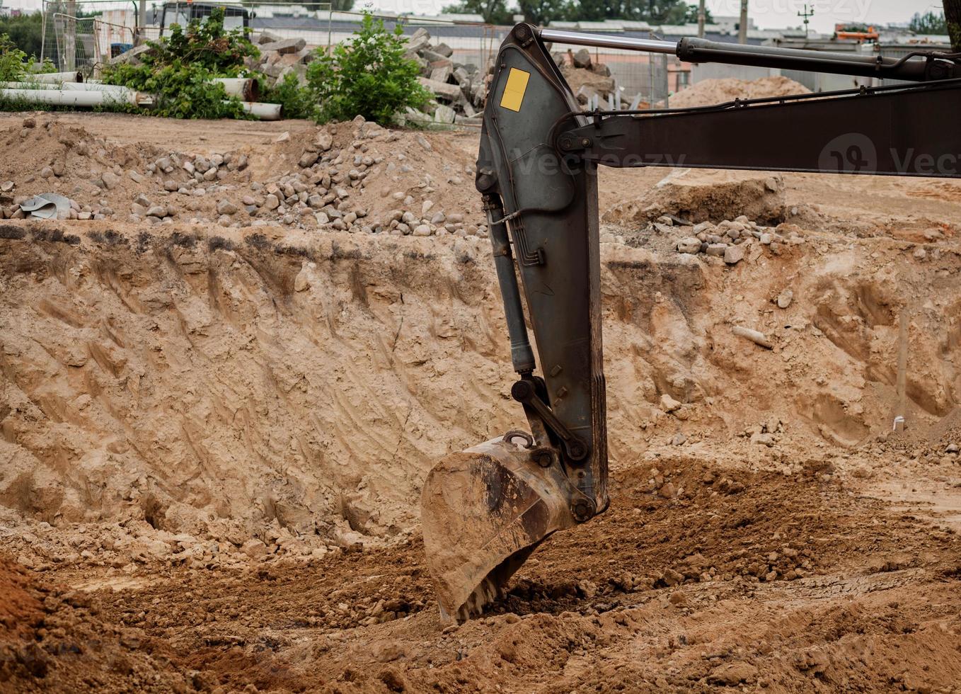 excavadora-tractor con una cuchara foto