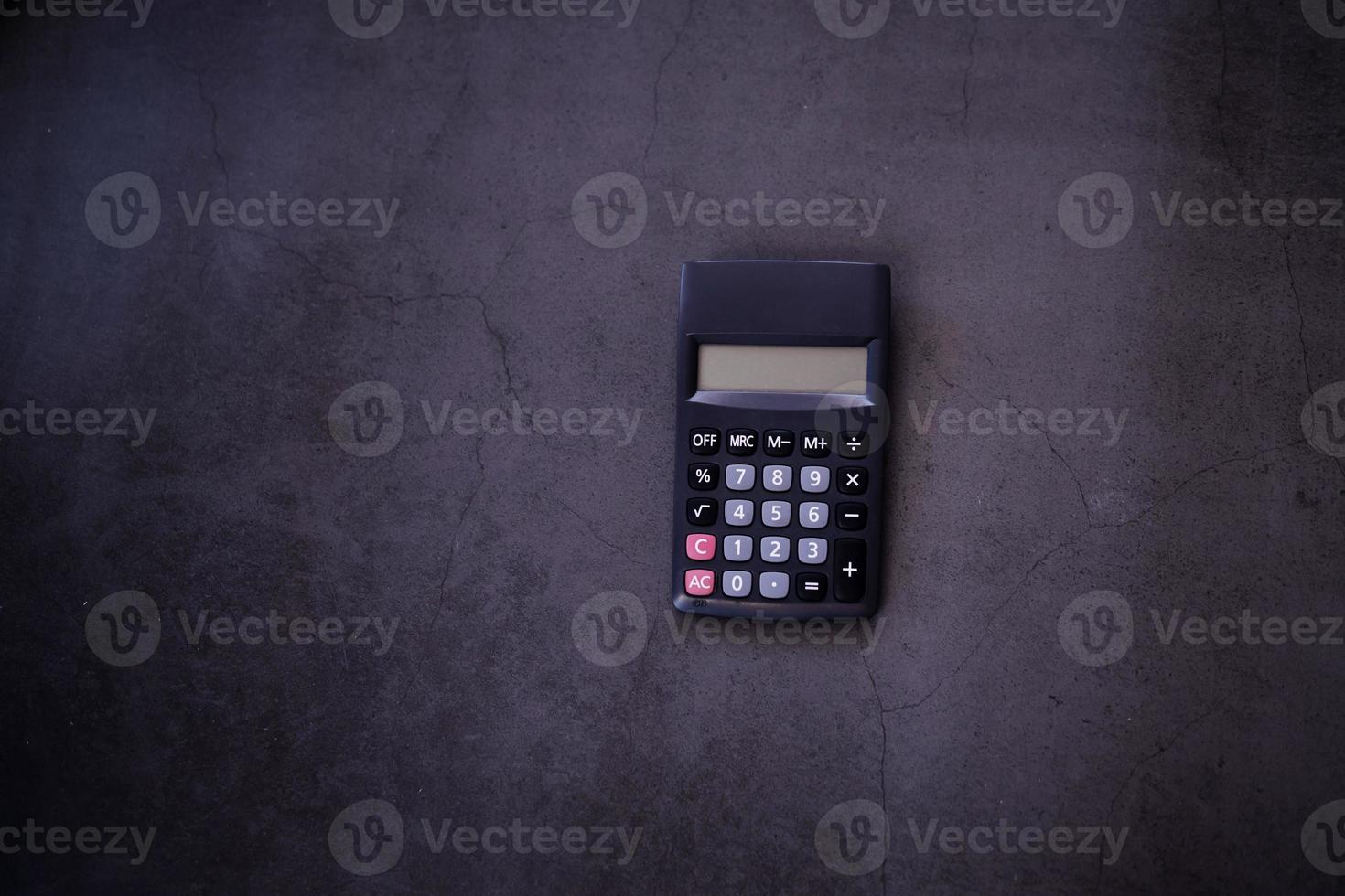 digital calculator on dark texture photo