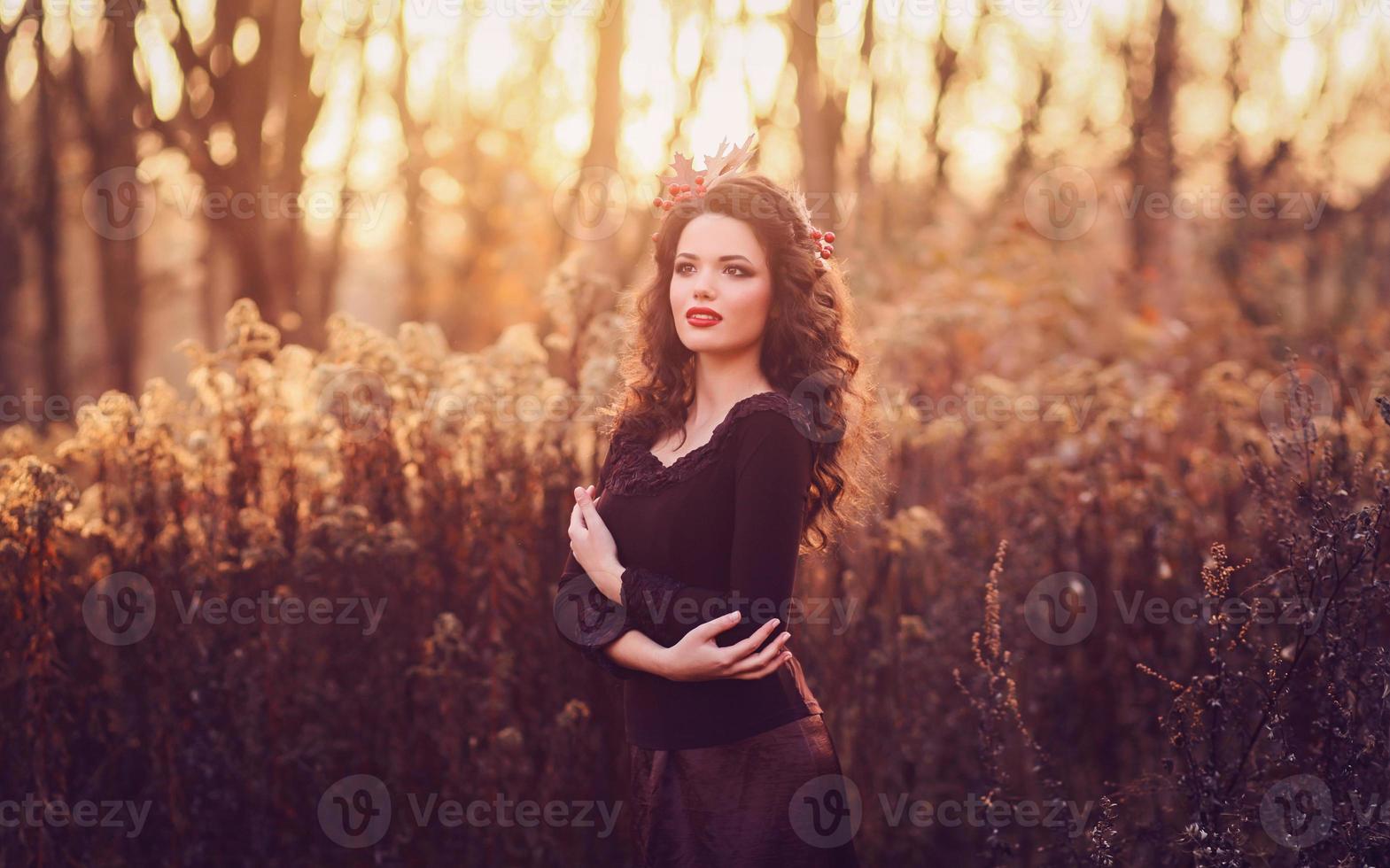 Beautiful brunette in forest photo