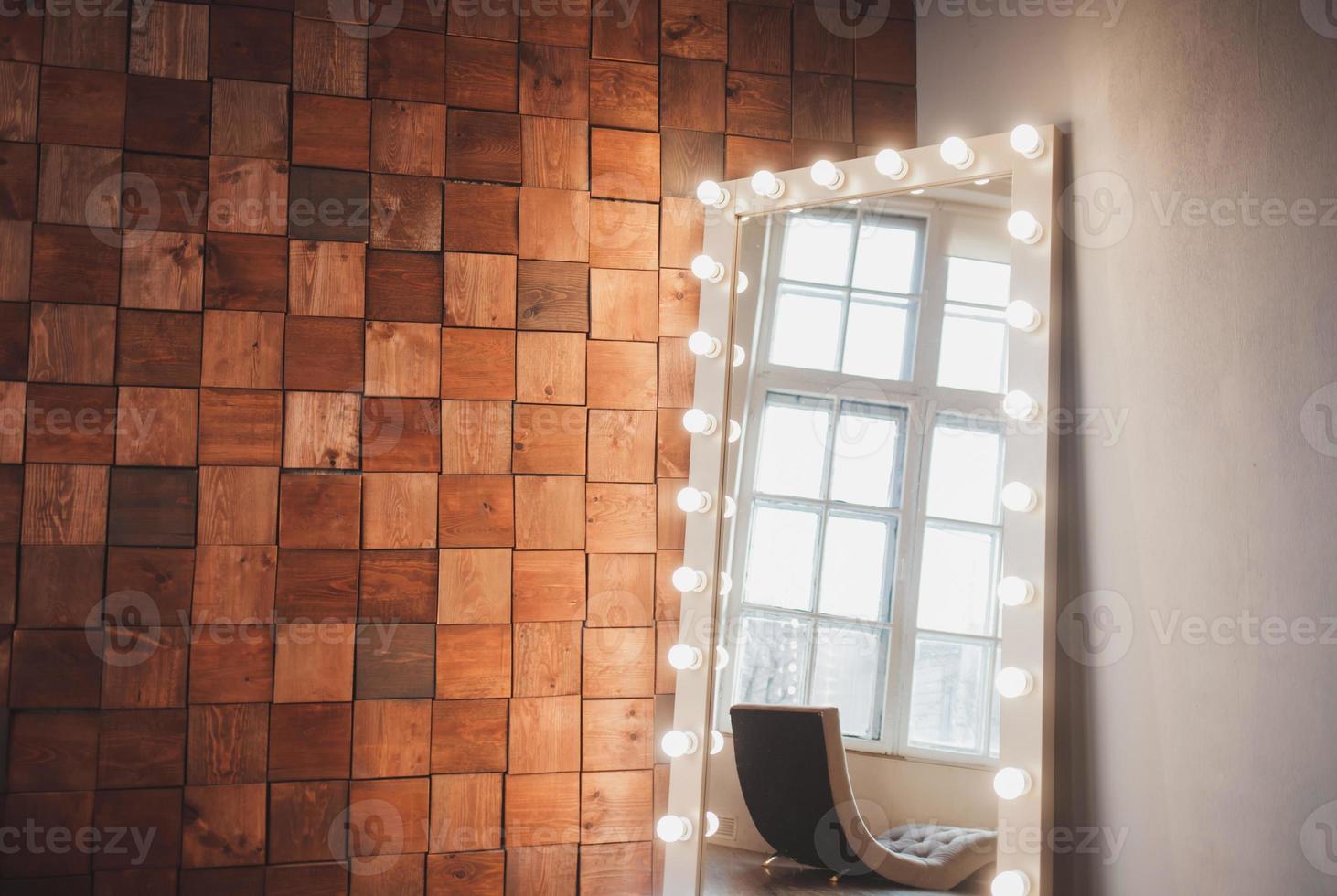 Long dressing mirror with light bulbs photo