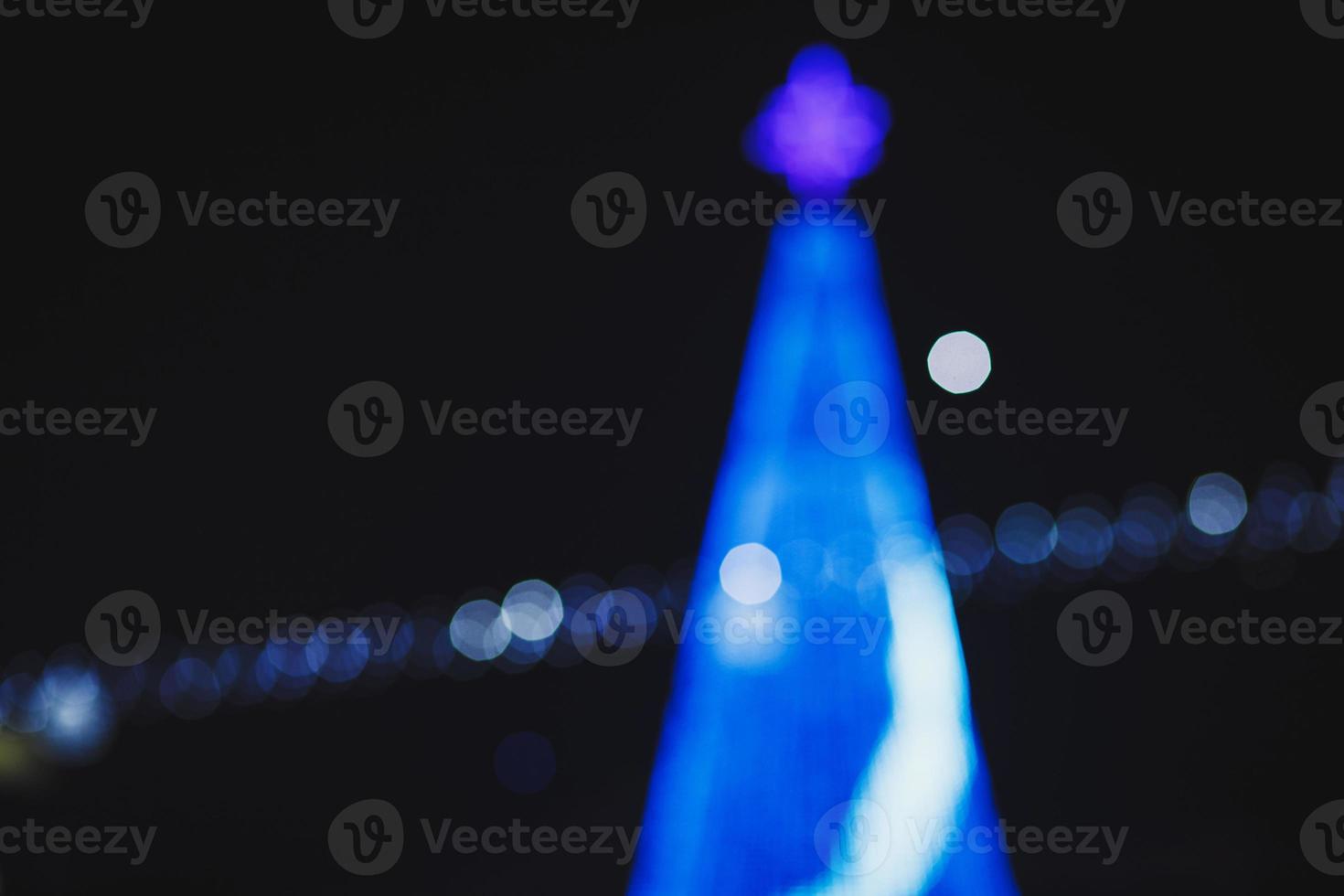 Blurred blue bokeh light background photo