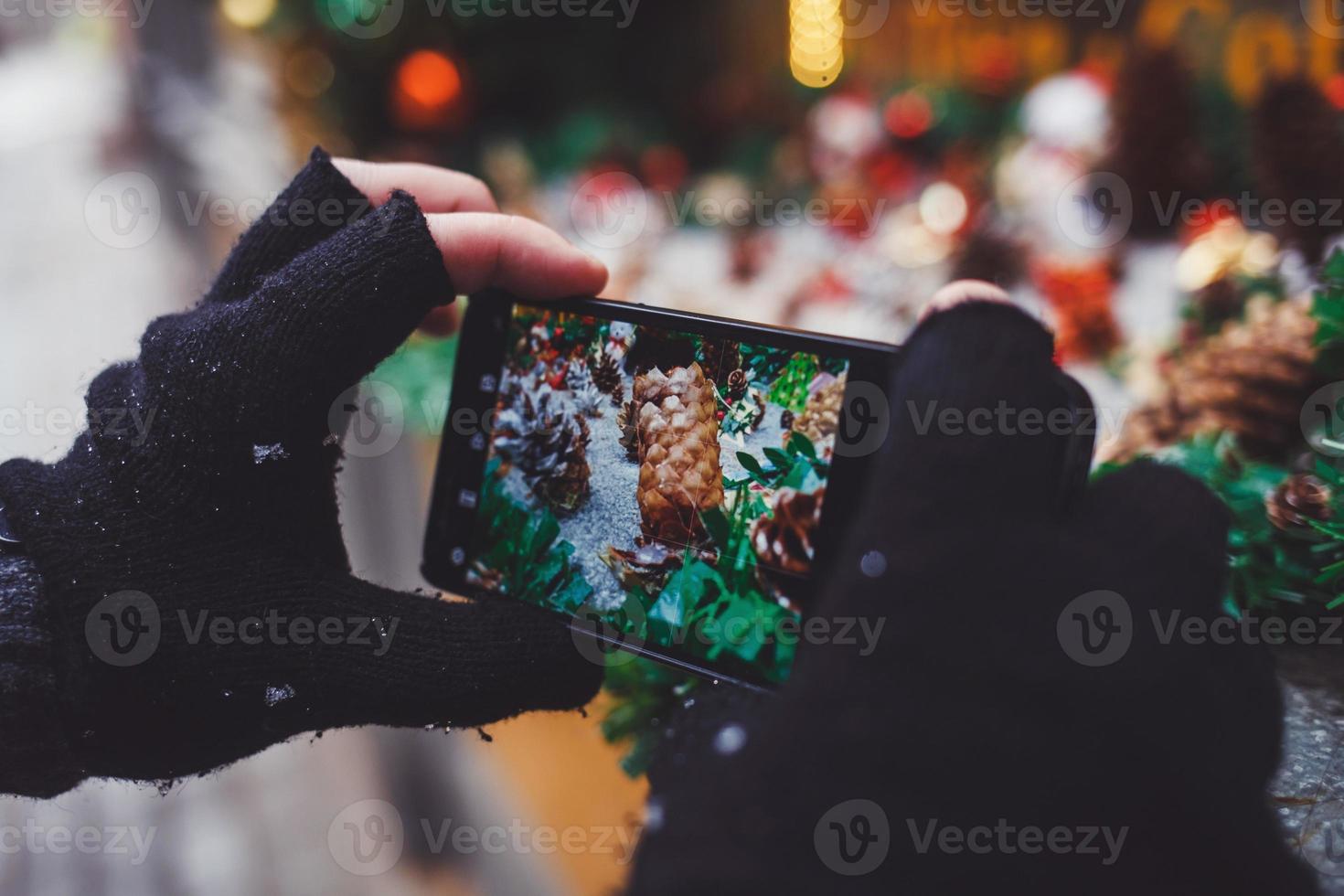 the hands of a tourist with a smartphone photo